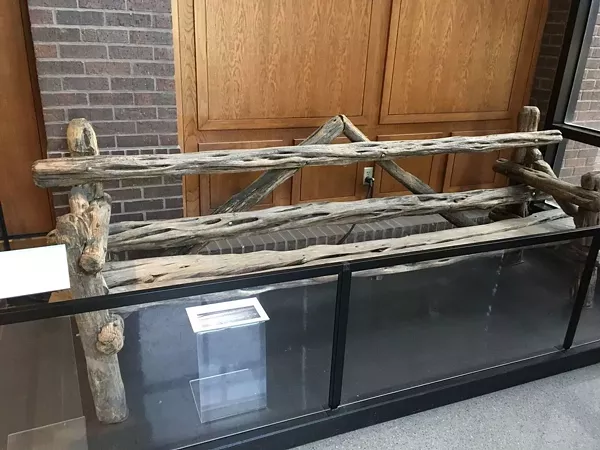 The "Johnny Loves Vivian" bench is now safely behind glass at the Witte's B. Naylor Morton Research and Collections Center. - PHOTO VIA ATLAS OBSCURA