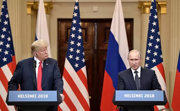 President Trump listens while Russian President Vladimir Putin speaks at the press conference following their Helsinki summit. - WIKIMEDIA COMMONS