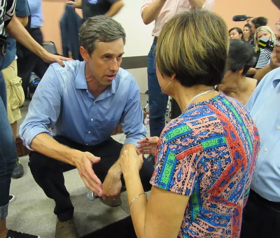 O’Rourke speaks to an audience member from the stage after the Corpus Christi town hall that drew more than 1,000 people. - SANFORD NOWLIN