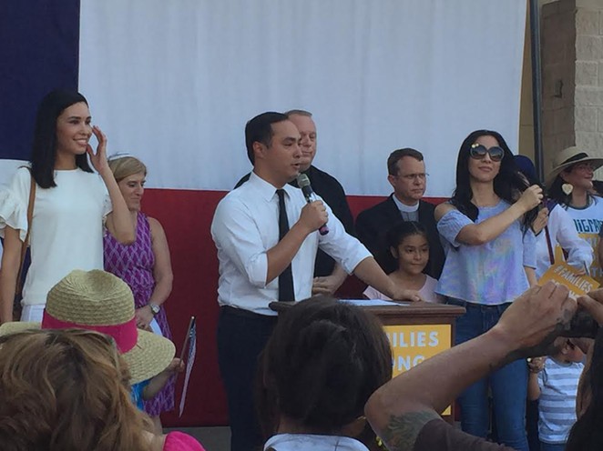 Joaquin Castro speaks at a recent immigration-reform rally, surrounded by his family and local faith leaders. - SANFORD NOWLIN