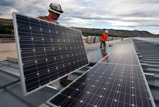 Workers conduct a solar panel installation project. - U.S. DEPARTMENT OF ENERGY