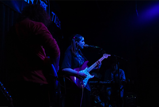 Sophie Allison, otherwise known as Soccer Mommy, sings and strums her pink Strat at the Paper Tiger. - DANIEL CONRAD