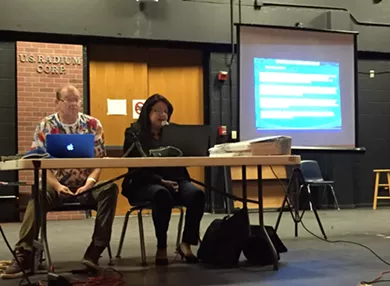 Monica Alcantara, right, presents allegations against BCDP officials before a vote on their removal. - SANFORD NOWLIN
