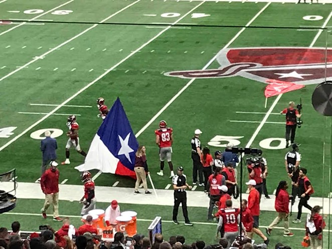 Activity swirls around the sidelines at the season's first San Antonio Commanders game. - SHAWN MITCHELL