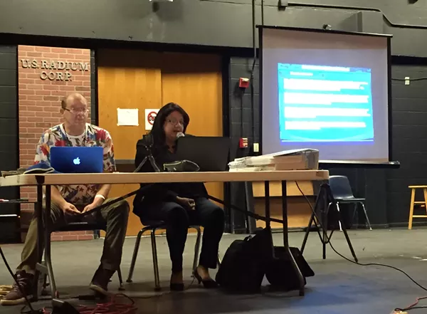 Monica Alcantara, right, presents allegations against BCDP officials before a vote on their removal at a recent meeting. - SANFORD NOWLIN