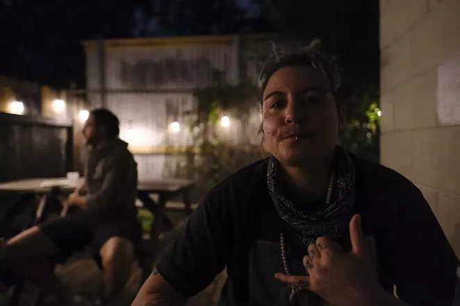 Pony Hawk (right) of SideShow Kitchen chills on the patio of Faust, where he and his partner run a kitchen for bar patrons. - DANIEL CONRAD