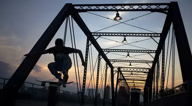 Jamal Nixon, 16, skates on the Hays Street Bridge recently. - NOAH ALCALA BACH | HERON CONTRIBUTOR