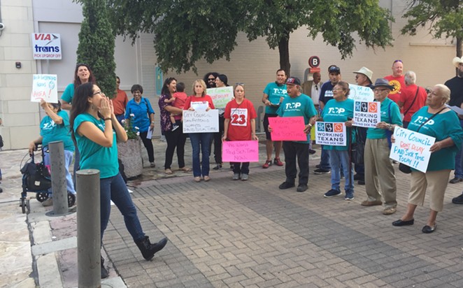 Activist Joleen Garcia leads paid sick time advocates in a rally outside of City Council chambers. - SANFORD NOWLIN