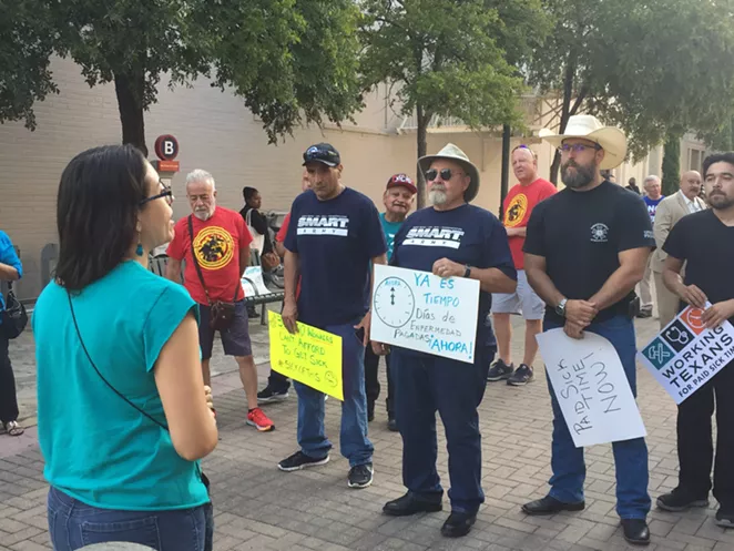 Union members and progressive activists gather outside of city council chambers last year to urge support of a paid sick time ordinance. - SANFORD NOWLIN