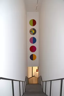 A felt installation from San Antonio artist Jesse Amado’s 30 Day RX Series hangs in one of Ruby City’s stairwells. - BRYAN RINDFUSS