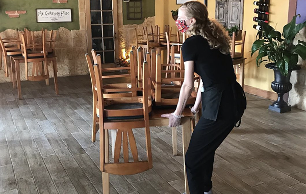 A Purple Garlic employee rearranges the dining room in preparation for reopening today. - INSTAGRAM / CERRONISPURPLEGARLIC