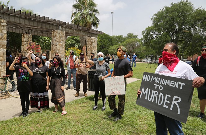 Advocates for the removal of the Christopher Columbus statue protest Saturday, June 27, 2020, at Columbus Park, 200 Columbus St. - BEN OLIVO / SAN ANTONIO HERON