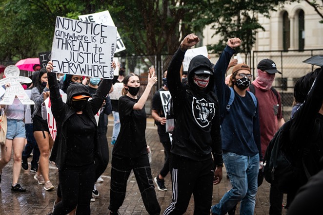Protesters march at a recent San Antonio anti-police brutality demonstration. - JAIME MONZON