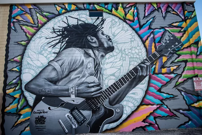 A portrait of Lonely Horse's Nick Long painted by Los Otros on the St. Mary's Strip. - JAIME MONZON