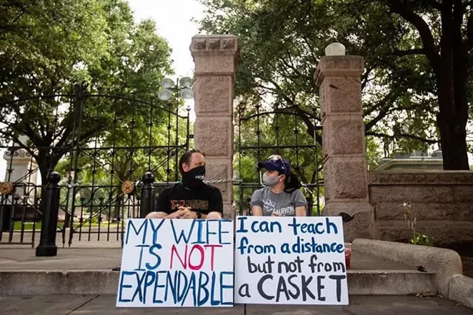 A Texas teacher and her husband attend a recent protest over the state's school reopening plan. - TWITTER / @BECKILAOSHI