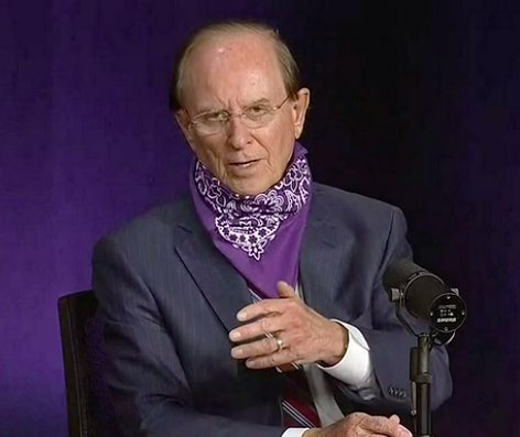 County Judge speaks during a recent press briefing with a bandana around his neck. - SCREEN CAPTURE / KSAT