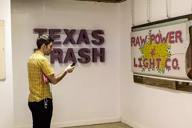 The original Raw Power and Light Company sign is part - ALEX RAMIREZ