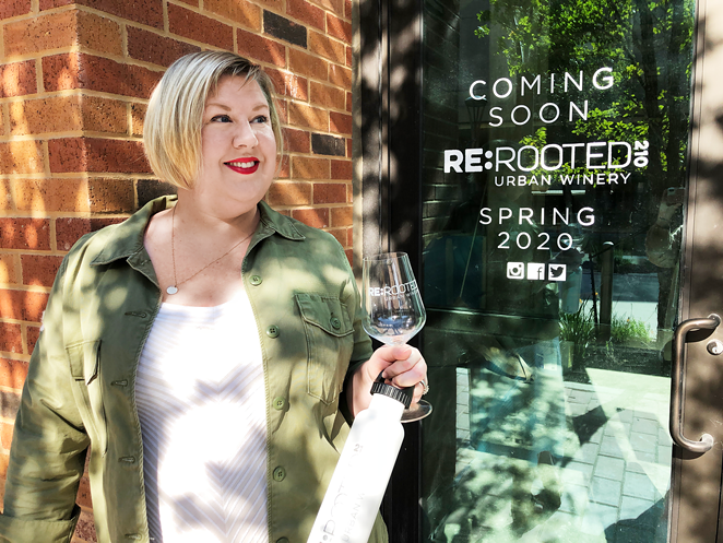 Jennifer Beckmann raises a glass outside of ReRooted 210, which is expected to open next month. - NINA RANGEL