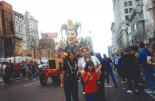 Itza Carbajal with her family during New Orleans' famous Mardi Gras celebration. Carbajal was evacuated to San Antonio, which she now happily calls home. She works at the Esperanza Peace & Justice Center. - COURTESY OF ITZA CARBAJAL