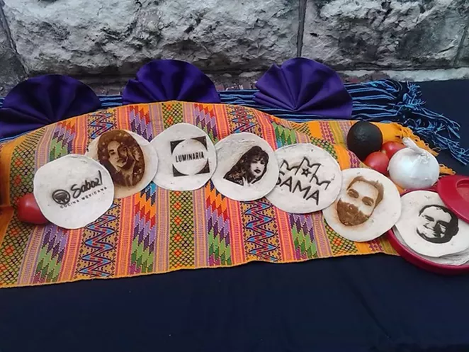 The Convergent Media Collective used a laser to burn images onto tortillas. They hope to raise money for a new laser to use during Luminaria 2015. The plan is to set up a photo booth so people can have their images burned onto tortillas. - PHOTO BY MARK REAGAN