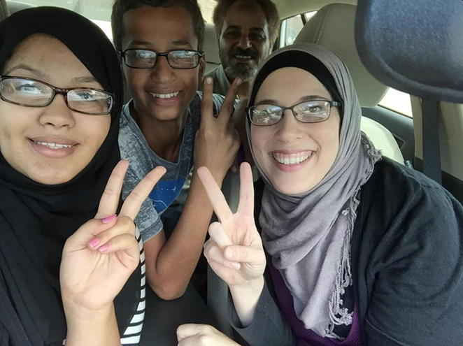 14-year-old Ahmed Mohamed (second from left) was arrested Monday after officials mistook his homemade clock for a bomb. - ALIA SALEM/TWITTER