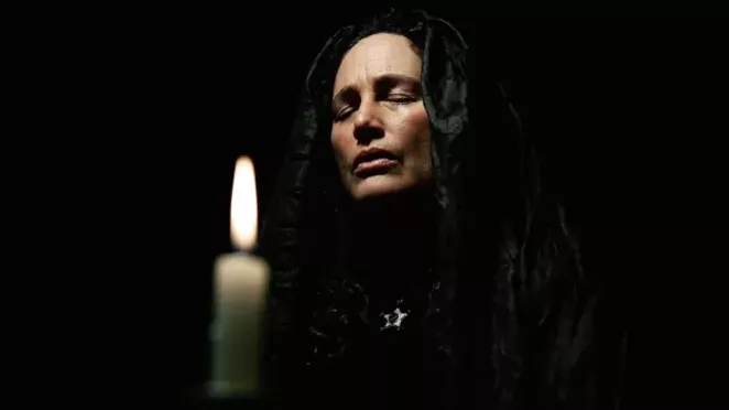Ivy (Toby Poser) communes with the spirits in the haunting and heartbreaking ghost story, "The Deeper You Dig." - ARROW VIDEO