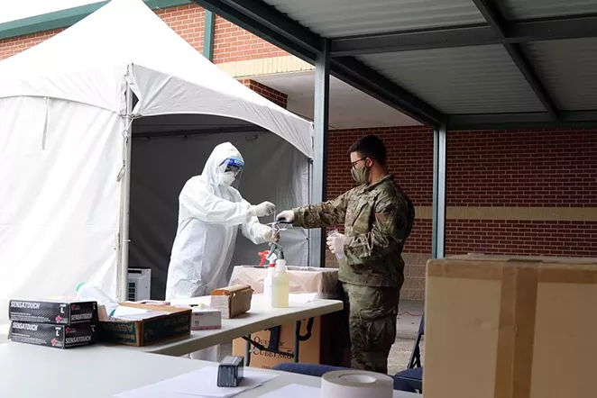 Texas Army National Guard Soldiers process sample bags containing COVID-19 tests. - WIKIMEDIA COMMONS / THE NATIONAL GUARD