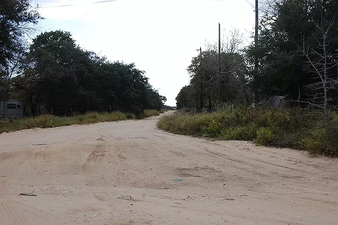 Driving on sandy Highland Oaks streets is a tricky balance. - MICHAEL MARKS