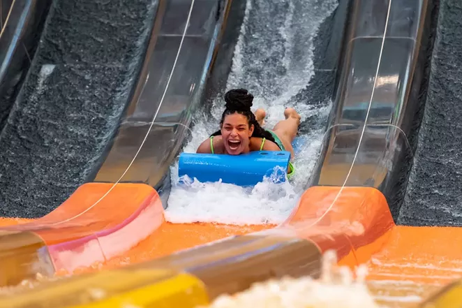 Singer songwriter Jordin Sparks rides the Cheetah Mat Racer maskless in a promo photo for the new indoor water park. - TWITTER / KALAHARIRESORTS