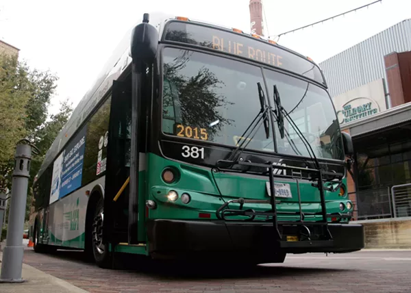 A VIA bus passes The Culinary Institute of America, San Antonio at the Pearl. - VIA METROPOLITAN TRANSIT