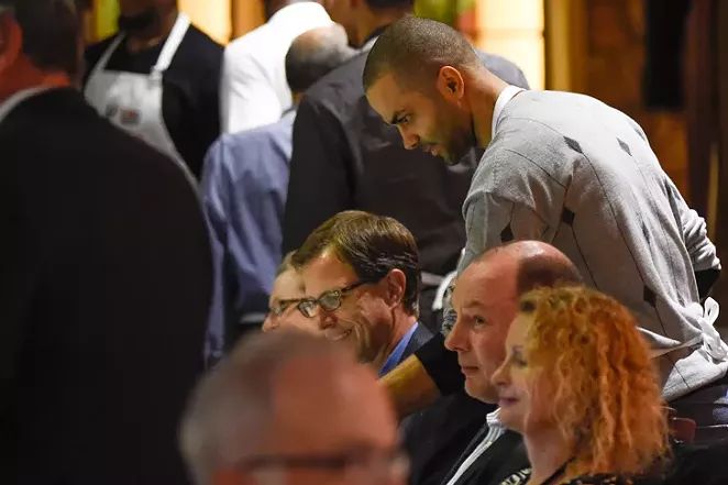Tony serving guests during the San Antonio Food Bank's Champions Against Hunger fundraiser at the Grill in Leon Springs. - ANDREW PATTERSON