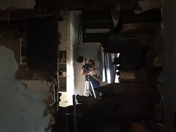 Filmmaker Mark Walley documents the damage inside Casa Chuck - COURTESY WALLEY FILMS