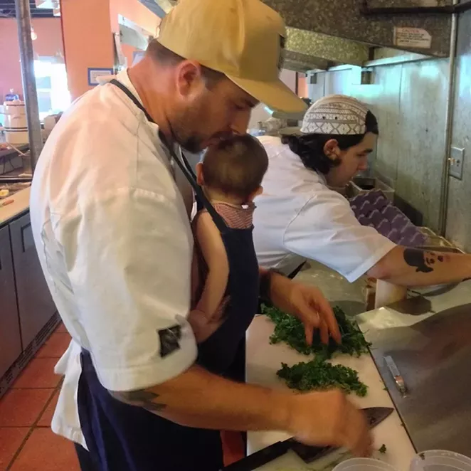 Sypesteyn cooking with his latest addition. - COURTESY