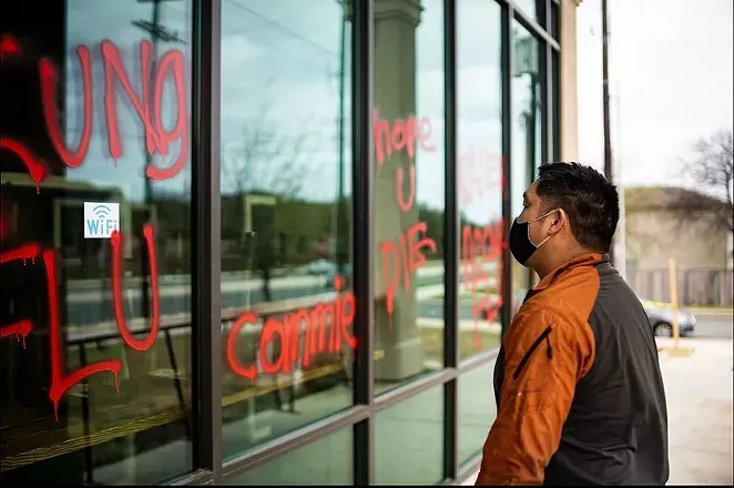 Noodle Tree owner Mike Nguyen surveys the vandalism to his restaurant on Sunday. - INSTAGRAM / @NOODLETREETX