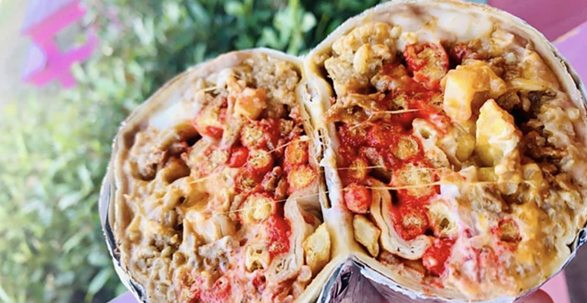 Big Poppas Tacos is famous locally for their "hoodrat" snacks, featuring flaming red Hot Cheetos and Fritos. - FACEBOOK / BIG POPPAS TACOS
