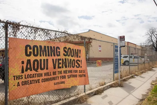 A sign outside SAY Sí’s new campus announces its imminent move. - STEPHANIE STOKES / SA HERON CONTRIBUTOR / @ESTEFOTOGRAFA