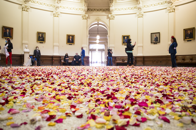 Young voting-rights activists dumped thousands of multicolored rose petals into the Capitol rotunda Thursday. - COURTESY PHOTO / JOLT ACTION