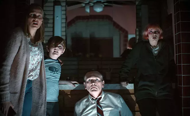 The family in the horror film "We Need to Do Something" looks out in terror. - ATLAS INDUSTRIES
