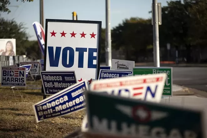 Voting signs at Dan Ruiz Branch Library in Austin on Election Day 2020. - TEXAS TRIBUNE / MIGUEL GUTIERREZ JR.