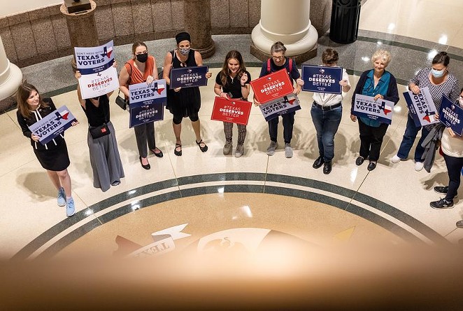 Activists gather outside a Senate committee hearing on proposed election reforms at the Capitol on Saturday, July 10, 2021. - TEXAS TRIBUNE / JORDAN VONDERHAAR