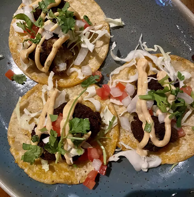 Cuishe offers a variety of street tacos, including a trompo with puerco al pastor. - RON BECHTOL