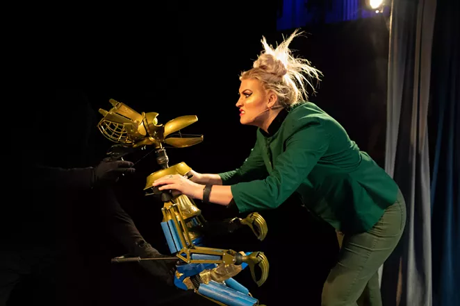Mega-Synthia harasses Crow T. Robot during a prior MST3K live tour. - BRANDI MORRIS