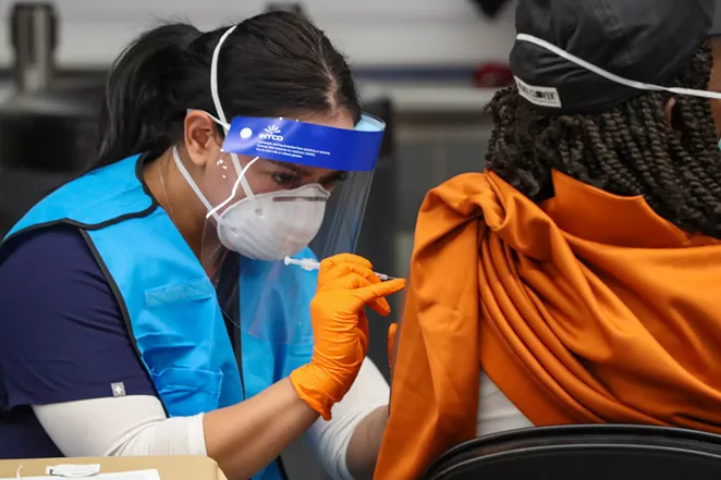 A woman receives her COVID-19 vaccination at the Alamodome. - COURTESY / CITY OF SAN ANTONIO