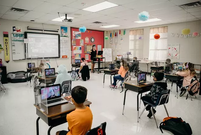 Plexiglass and 6 feet of space between each desk keep students socially distanced in Abigail Boyett’s third grade classroom. - TEXAS TRIBUNE / ALEJANDRA CASAS