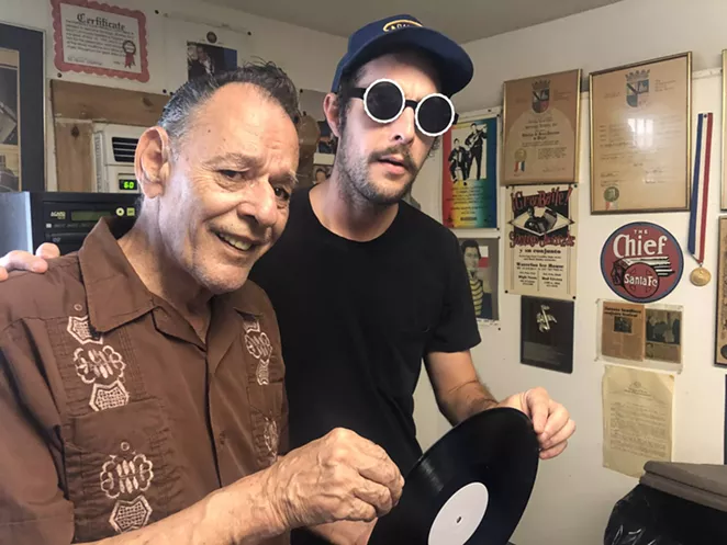 Garrett T. Capps (right) and Santiago Jimenez Jr. get ready to listen to a test pressing of the conjunto legend’s latest album. - BILL BAIRD