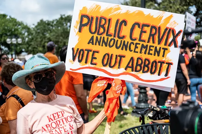 A woman protests Texas' near-total abortion ban at a march in San Antonio last weekend. - JAIME MONZON
