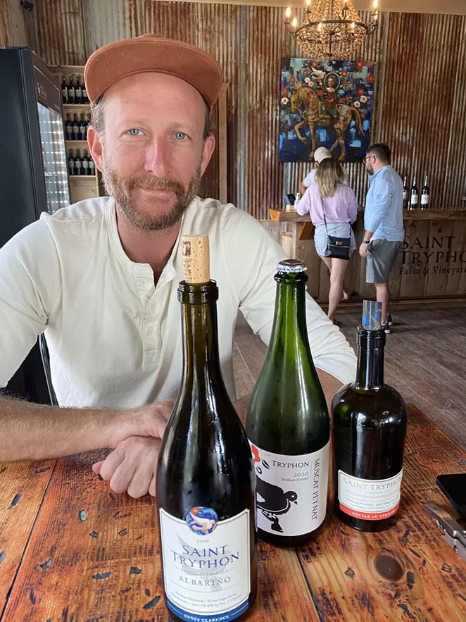 Silouan Bradford of Saint Tryphon shows off some of his winery's tasty output. - RON BECHTOL