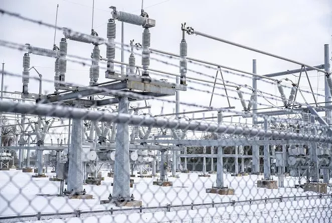Snow surrounds an Austin Energy station on Feb. 18. - TEXAS TRIBUNE / SERGIO FLORES