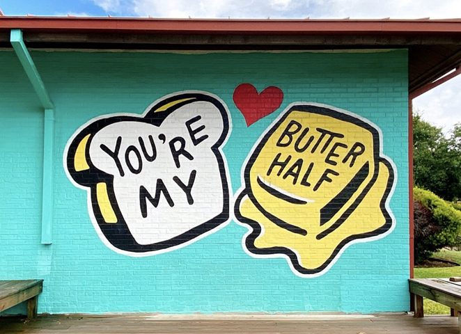 The original version of the mural read,"You're My Butter Half." - INSTAGRAM / COFFEEYED.DR.KIM