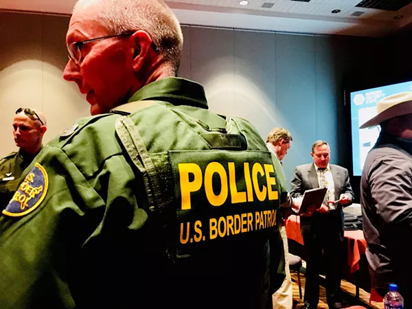 One of many Border Patrol agents in uniform at the Expo. - DEBBIE NATHAN